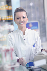 Image showing pharmacist chemist woman standing in pharmacy drugstore