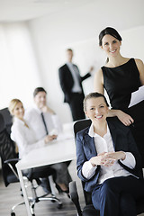 Image showing business woman with her staff in background