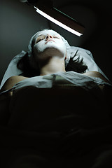 Image showing woman with facial mask in cosmetic studio