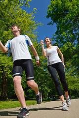 Image showing Young couple jogging