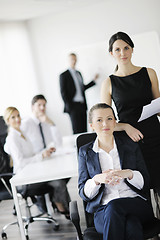 Image showing business woman with her staff in background