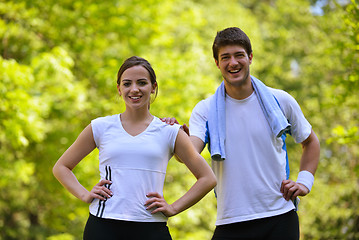 Image showing Couple doing stretching exercise  after jogging