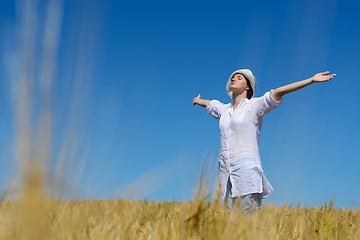 Image showing young woman in wheat field at summer