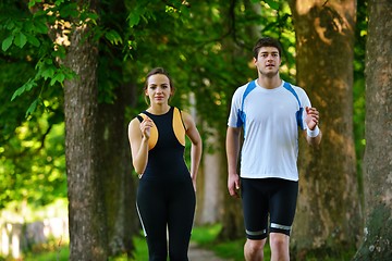 Image showing Young couple jogging