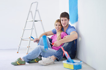 Image showing happy young cople relaxing after painting in new home