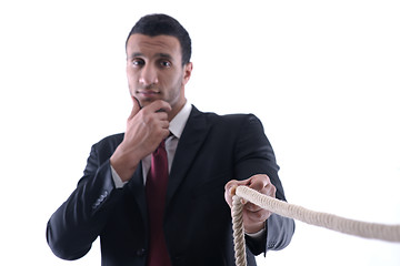 Image showing business man with rope isolated on white background