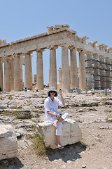 Image showing Greek woman on the streets of Oia, Santorini, Greece