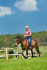 Image showing happy woman  on  horse