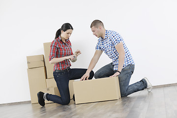 Image showing Young couple moving in new home