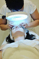 Image showing woman with facial mask in cosmetic studio