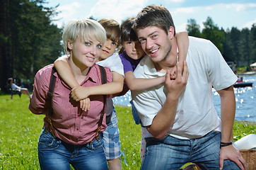 Image showing happy young family have fun outdoors