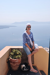 Image showing Greek woman on the streets of Oia, Santorini, Greece