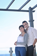 Image showing couple relaxing on balcony