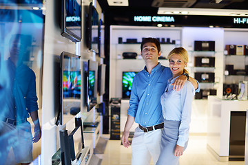 Image showing Young couple in consumer electronics store