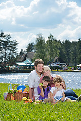 Image showing Happy family playing together in a picnic outdoors