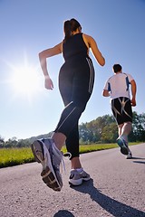 Image showing Young couple jogging