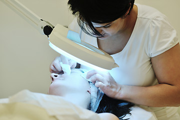 Image showing woman with facial mask in cosmetic studio