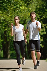 Image showing Young couple jogging at morning