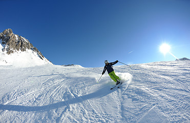 Image showing skiing on fresh snow at winter season at beautiful sunny day