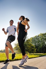 Image showing Young couple jogging