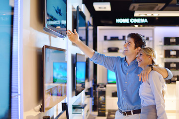 Image showing Young couple in consumer electronics store