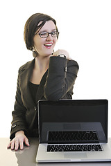 Image showing business woman working on laptop isolated on white