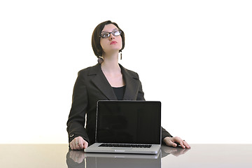 Image showing business woman working on laptop isolated on white