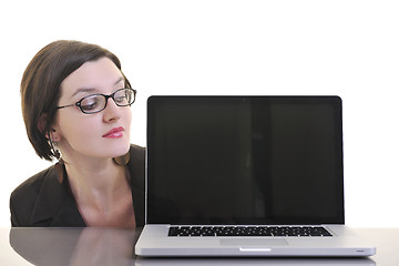 Image showing business woman working on laptop isolated on white