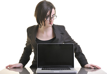 Image showing business woman working on laptop isolated on white