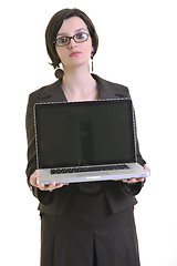 Image showing business woman working on laptop isolated on white