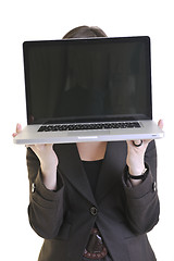 Image showing business woman working on laptop isolated on white