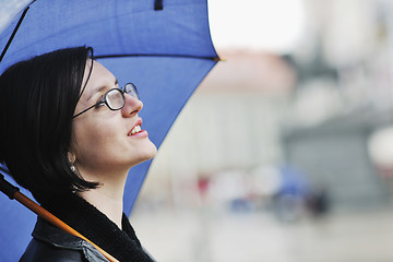 Image showing woman on street with umbrella