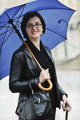 Image showing woman on street with umbrella