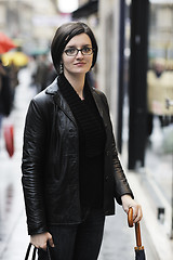 Image showing woman on street with umbrella