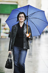 Image showing woman on street with umbrella