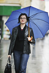 Image showing woman on street with umbrella