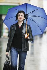 Image showing woman on street with umbrella