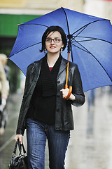 Image showing woman on street with umbrella