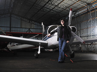 Image showing young woman with private airplane