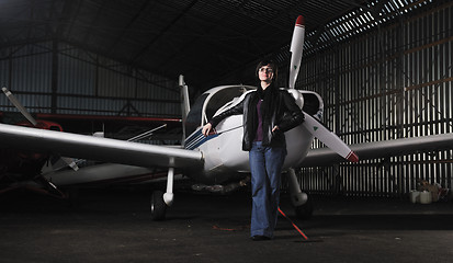 Image showing young woman with private airplane