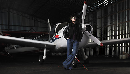 Image showing young woman with private airplane