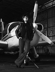 Image showing young woman with private airplane