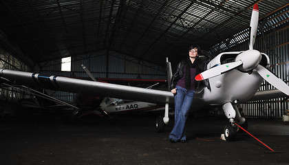 Image showing young woman with private airplane