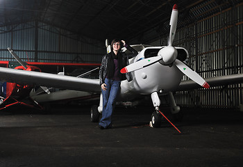 Image showing young woman with private airplane