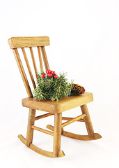 Image showing Wooden rocking chair with Christmas decorations