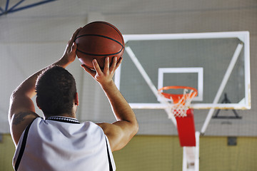 Image showing basketball player shooting