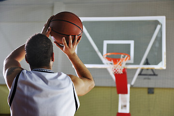 Image showing basketball player shooting