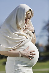 Image showing happy young pregnant woman outdoor