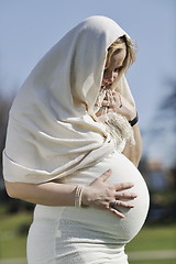 Image showing happy young pregnant woman outdoor