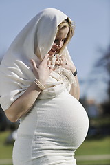 Image showing happy young pregnant woman outdoor